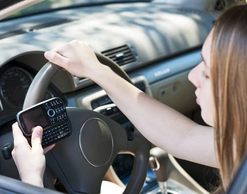 Teenage girl texting and driving