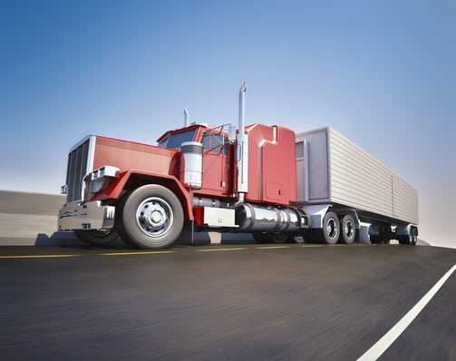 An 18 wheeler Semi-Truck sppeding on highway