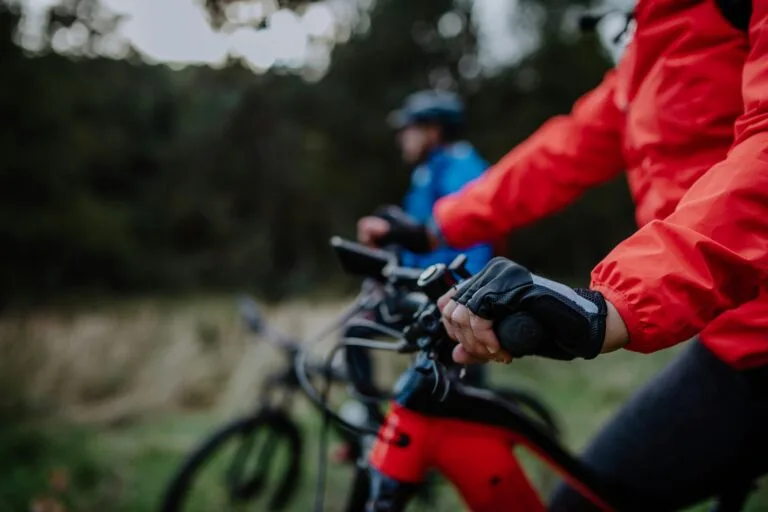 two people cycling in the autumn time